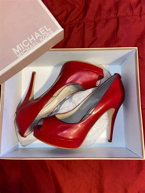 michael kors buys louboutin